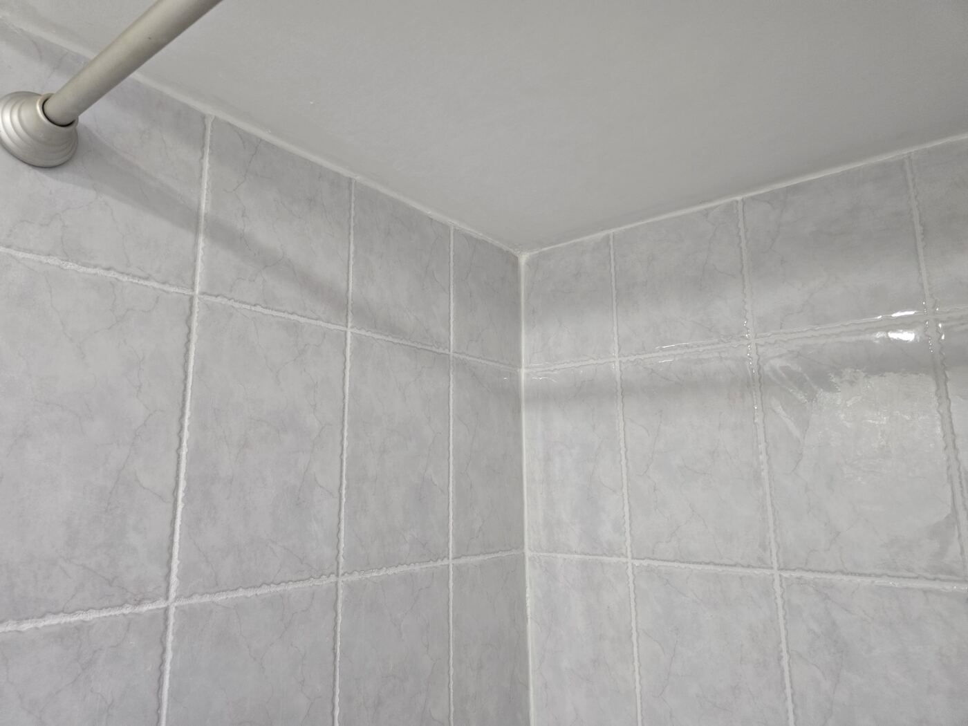 After: restored grout lines running up to the ceiling